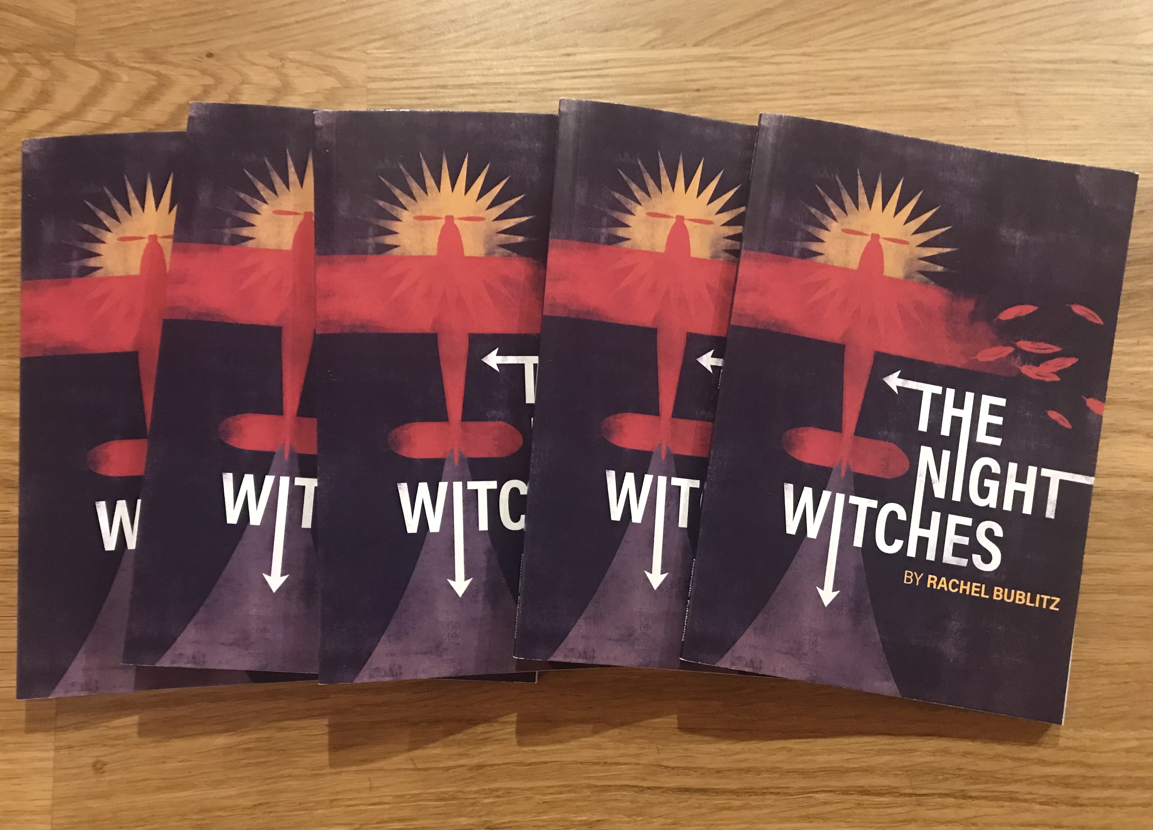 Photo of a stack of THE NIGHT WITCHES scripts from Dramatic Publishing.